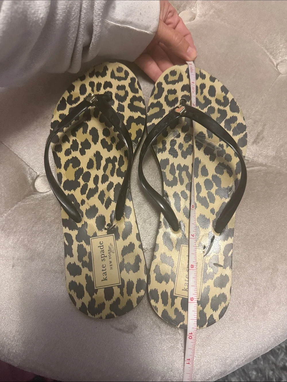 Kate Spade black strap flip-flops with spade logo
